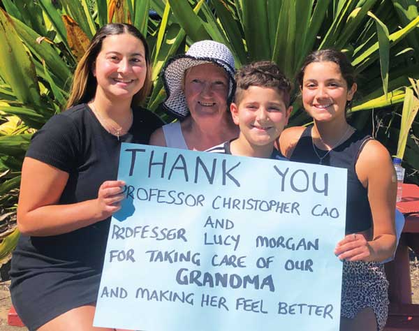 Family thanking Dr Christopher Cao for caring for their grandmother during lung cancer treatment and surgery